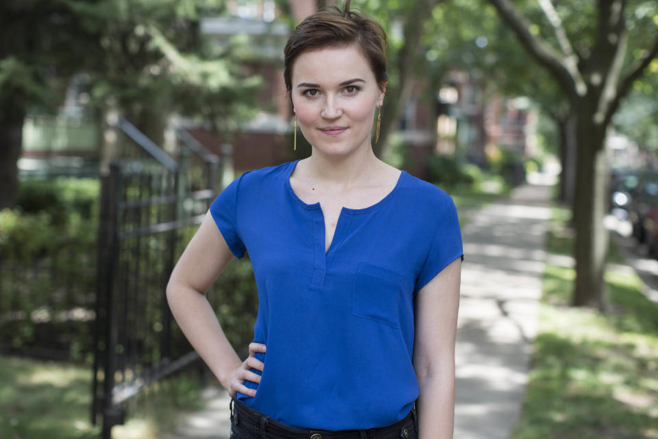 In this Aug. 8, 2013, photo, author Veronica Roth poses for a portrait in Chicago. The 25-year-old Chicagoan is author of the best-selling dystopian teen trilogy that includes "Divergent," "Insurgent" and Tuesday, Oct. 22, 2013 release of the third and final book, "Allegiant." So far the series has sold 5 million copies in the U.S. Come Monday night Harry Potter-style midnight release parties are planned across the country for “Allegiant.” (AP Photo/Scott Eisen)