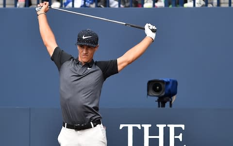 Thorbjorn Olesen stretches at the first tee - Credit: GLYN KIRK/AFP/Getty Images