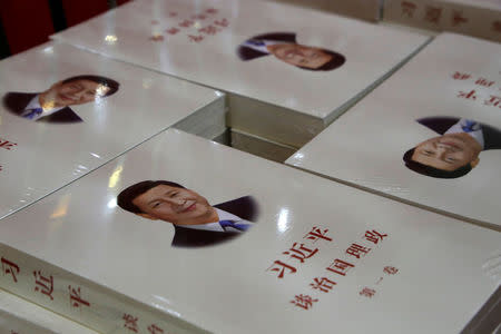 Copies of book "Xi Jinping: The governance of China" are displayed for sale at a bookstore in Beijing, China, March 1, 2018. REUTERS/Jason Lee