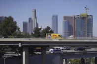 Motorists wait on a highway ramps in heavy traffic after a fore on a section of Interstate 10, Tuesday, Nov. 14, 2023, in Los Angeles. California Gov. Gavin Newsom says a stretch of Interstate 10 in Los Angeles that was burned in an act of arson does not need to be demolished, and that repairs will take an estimated three to five weeks. Newsom announced the finding Tuesday, based on analysis of core samples taken from the freeway, a vital artery used by 300,000 vehicles daily. (AP Photo/Damian Dovarganes)