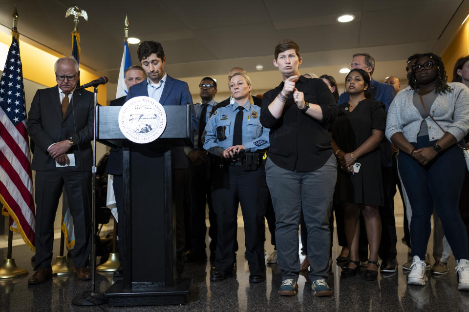 Mayor Jacob Frey, at podium, speaks at a news conference following a fatal shooting, in Minneapolis, Thursday, May, 30, 2024. Minneapolis police Officer Jamal Mitchell was among those killed. (Renée Jones Schneider/Star Tribune via AP)