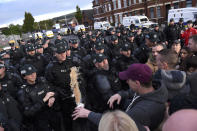 <p>A hot drink is thrown at police during a clash in the nationalist Ardoyne area as residents protest against a decision to allow the return of the loyalist Orange order parade through Ardoyne, in Belfast, Northern Ireland, Oct. 1, 2016. (Photo: Clodagh Kilcoyne/Reuters)</p>