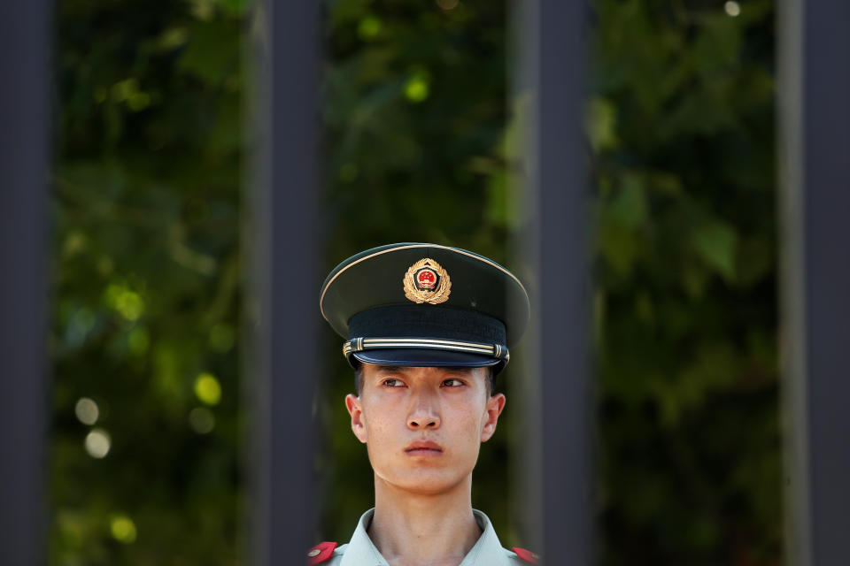 <p>A paramilitary police officer stands guard near the site of a blast at the U.S. Embassy in Beijing, July 26, 2018. (Photo: Damir Sagolj/Reuters) </p>