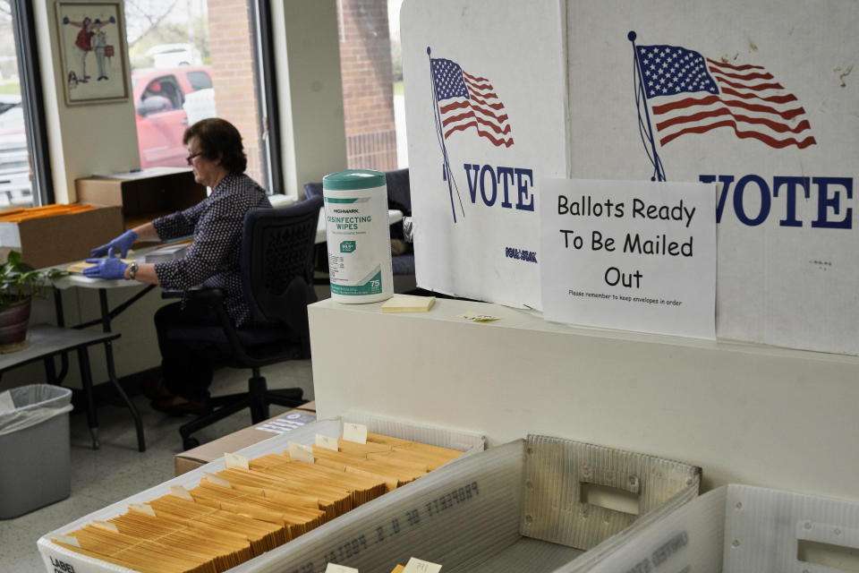 In this April 14, 2020 photo, mail-in ballots ready to be mailed are seen at the Lancaster County Election Committee offices in Lincoln, Neb. Officials in Nebraska are forging ahead with plans for the state’s May 12 primary despite calls from Democrats to only offer voting by mail and concerns from public health officials that in-person voting will help the coronavirus spread. Republican leaders have encouraged people to request absentee ballots but say polling places will be open. (AP Photo/Nati Harnik)