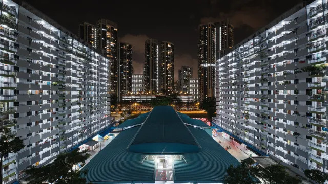 Toa Payoh housing estate in Singapore at night, illustrating a story on increasing electricity tariffs.