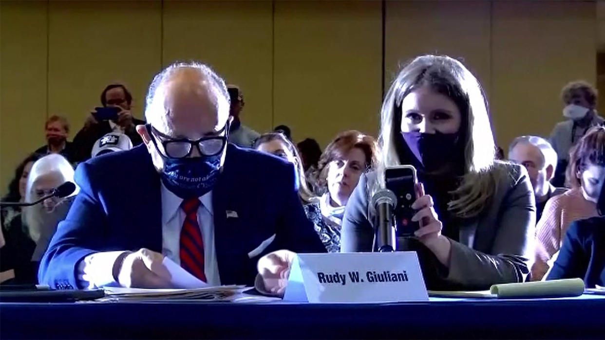 Rudy Giuliani and Jenna Ellis listen to President Trump on the speaker phone during the hearing. (via Reuters TV)