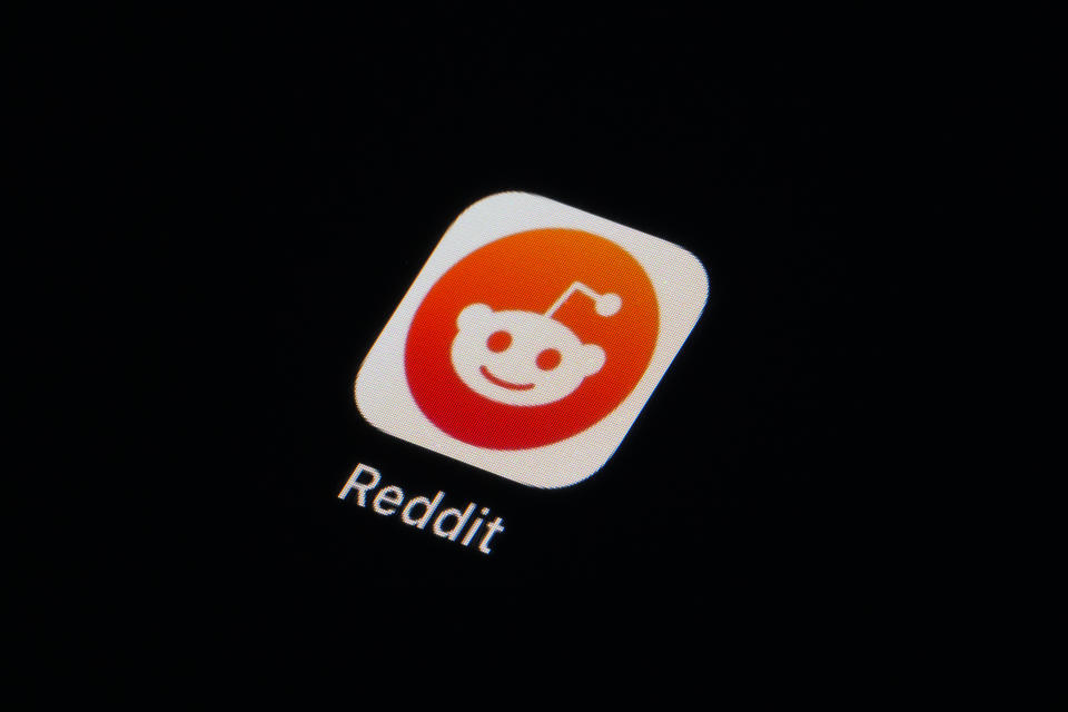 The Reddit app icon is seen on a smartphone, Tuesday, Feb. 28, 2023, in Marple Township, Pa. Reddit is facing an ongoing blackout from some of its most active users. After outrage erupted over plans to charge some third party apps for API, thousands of communities within the online discussion network went dark this week — and many organizers say their protest is not over. (AP Photo/Matt Slocum)