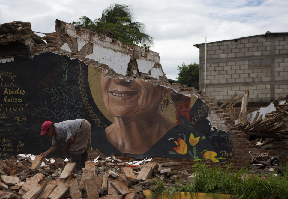 <p>A man recovers bricks from a building destroyed in Thursday’s magnitude 8.1 earthquake, in Union Hidalgo, Oaxaca state, Mexico, Sunday, Sept. 10, 2017. Mexico’s government is distributing food to jittery survivors of an earthquake while residents have continued to sleep outside, fearful of more collapses and aftershocks. (AP Photo/Rebecca Blackwell) </p>