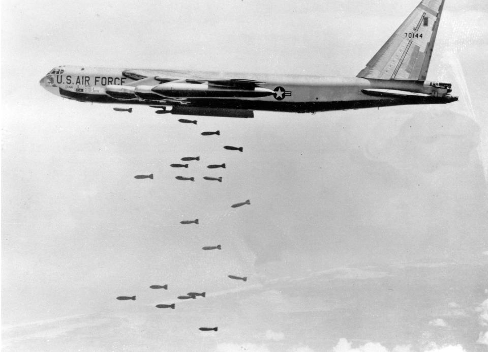 FILE - In this March 1966, file photo, a U.S. Air Force B-52 delivers a bomb load of more than 38,000 pounds against Viet Cong strongholds in South Vietnam during the Vietnam War. The Vietnamese capital Hanoi once trembled as waves of American bombers unleashed their payloads, but when Kim Jong Un arrives here for his summit with President Donald Trump he won’t find rancor toward a former enemy. Instead, the North Korean leader will get a glimpse at the potential rewards of reconciliation. (AP Photo, File)