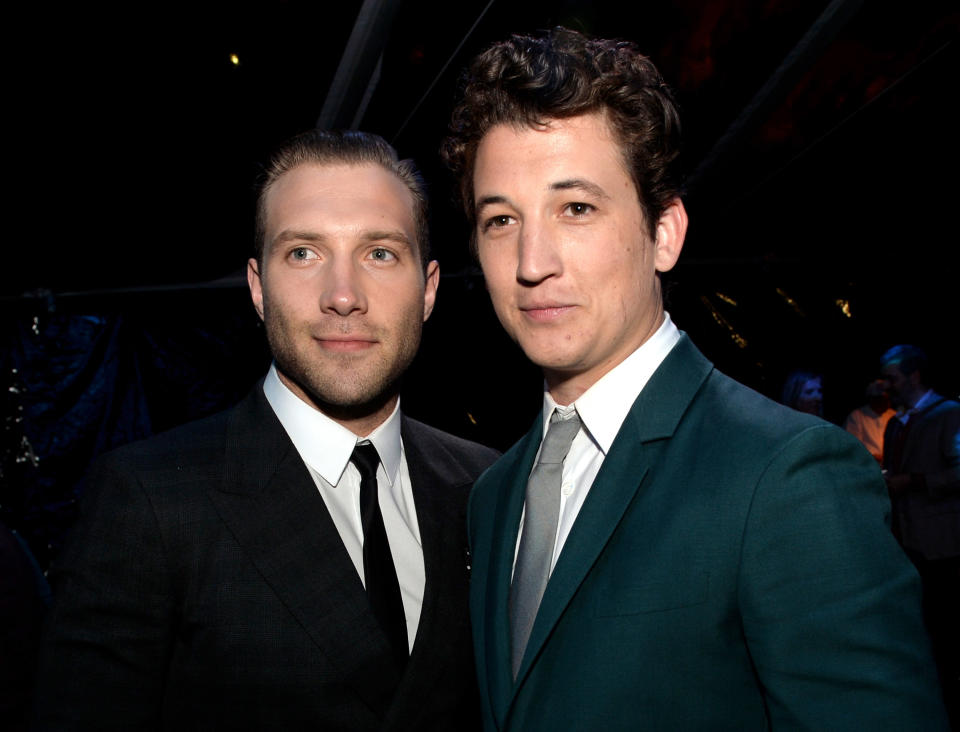 LOS ANGELES, CA - MARCH 18:  Actors Jai Courtney (L) and Miles Teller pose at the after party for the premiere of Summit Entertainment's 'Divergent' at The Armand Hammer Museum on March 18, 2014 in Los Angeles, California.  (Photo by Kevin Winter/Getty Images)