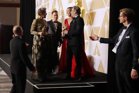 90th Academy Awards - Oscars Backstage - Hollywood, California, U.S., 04/03/2018 – Gary Oldman, winner for Best Actor for "Darkest Hour," Frances McDormand, winner for Best Actress for “Three Billboards Outside Ebbing, Missouri," Sam Rockwell, winner for Best Supporting Actor award for “Three Billboards Outside Ebbing, Missouri,” and Allison Janney, winner for Best Supporting Actress Award for "I, Tonya." REUTERS/Mike Blake