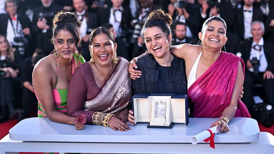 Kani Kusruti, Chhaya Kadam, Payal Kapadia and Divya Prabha pose with the Grand Prix award for "All We Imagine As Light" during the festival's closing ceremony. - Stephane Cardinale/Corbis/Getty Images