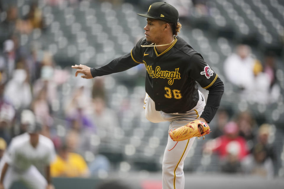 Pittsburgh Pirates relief pitcher Dauri Moreta works in the ninth inning of a baseball game against the Colorado Rockies Wednesday, April 19, 2023, in Denver. (AP Photo/David Zalubowski)