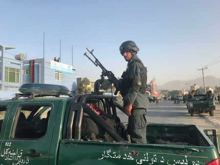 An Afghan policeman stands at the site of a blast in Kabul, Afghanistan September 13, 2017. REUTERS/Mohammad Ismail