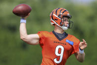 Cincinnati Bengals' Joe Burrow throws a pass during an NFL football practice in Cincinnati, Wednesday, July 28, 2021. (AP Photo/Aaron Doster)