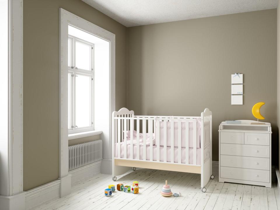 modern nursery room with blank frame