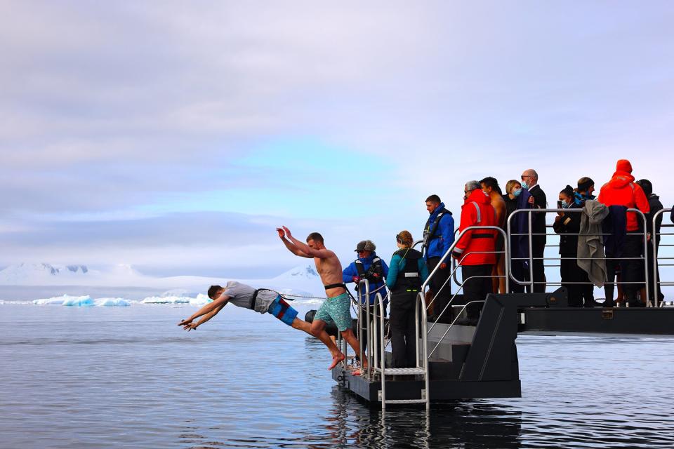 Passengers aboard Scenic Eclipse take a polar plunge off Prospect Point, Antarctic