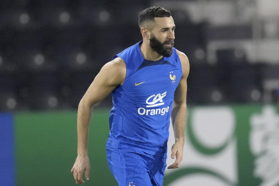 France's Karim Benzema runs during a training session at the Jassim Bin Hamad stadium in Doha, Qatar, Saturday, Nov. 19, 2022. France will play their first match in the World Cup against Australia on Nov. 22. (AP Photo/Christophe Ena)