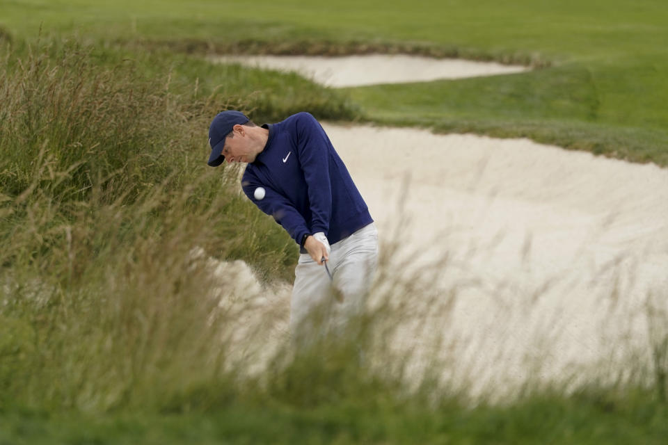 Rory McIlroy, of Northern Ireland, hits from a fairway bunker on the third hole during the third round of the U.S. Open Championship golf tournament Saturday, June 15, 2019, in Pebble Beach, Calif. (AP Photo/David J. Phillip)