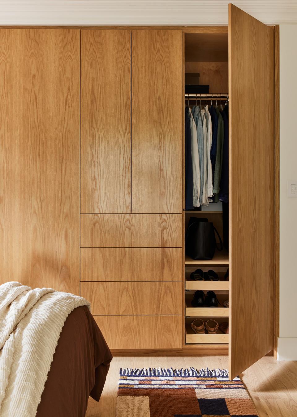 “The homeowners wanted plenty of closet space in their primary suite. We redesigned the small cramped walk-in closet and installed a floor-to-ceiling wardrobe that was perfect for their needs,” says Tina.