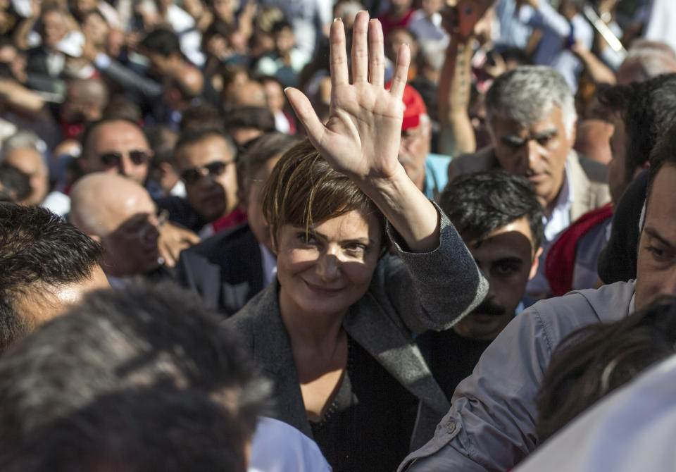 Canan Kaftancioglu, the head of Turkey's secular Republican People's Party in Istanbul, gestures after her trial in Istanbul, Friday, Sept. 6, 2019. Turkey's state-run news agency says a court has sentenced the leader of the Istanbul branch of Turkey's main opposition party to nearly 10 years in prison over a series of tweets.(AP Photo)