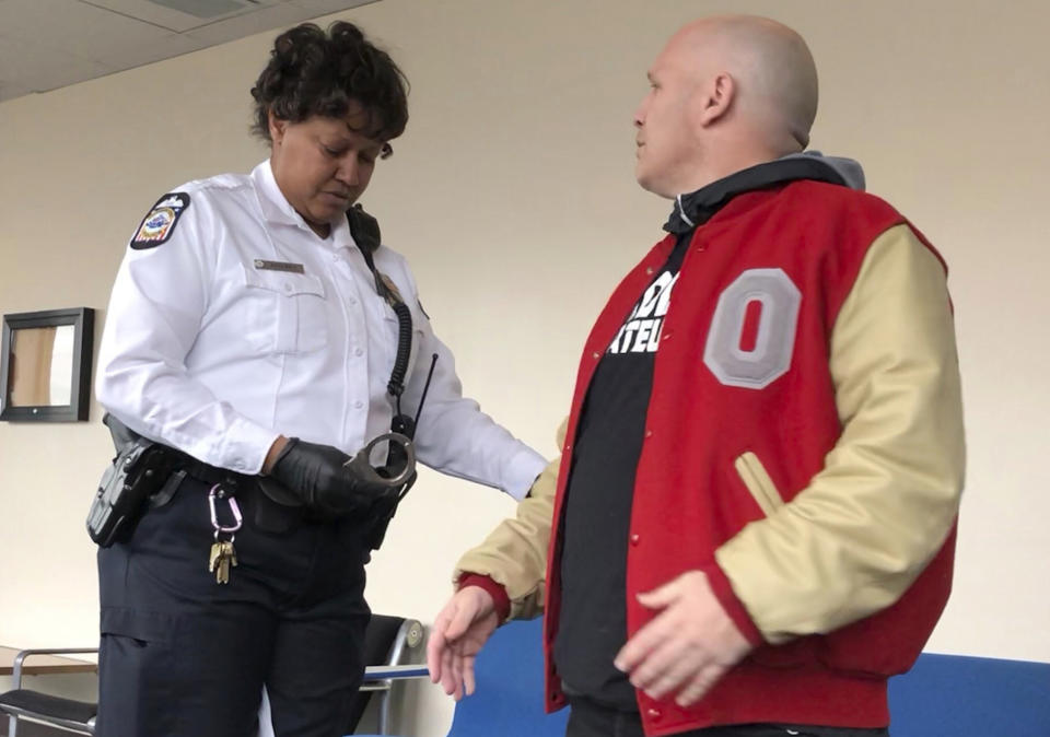 Mike DiSabato, right, was arrested for missing a court date tangentially related to decades-old abuse allegations at Ohio State. (AP Photo/Kantele Franko)