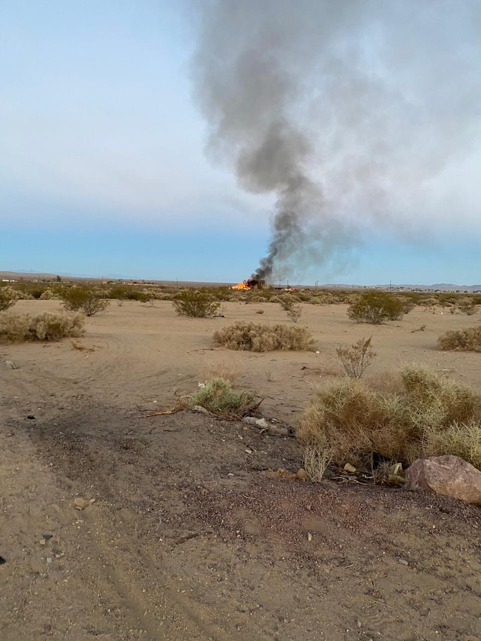 Thick clouds of black smoke could be seen emanating miles away from a house fire in Barstow around 5 a.m. on July 11, 2022.