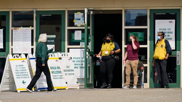 A woman walks into Ohio’s Covid-19 mass vaccination clinic at Cleveland State University