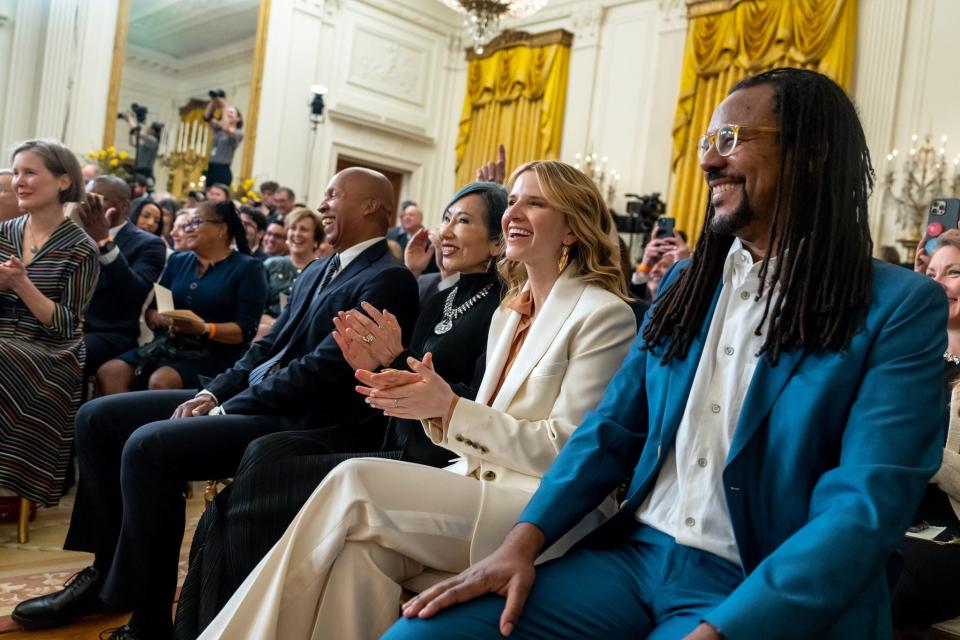 Bryan Stevenson sits among other award recipients at the National Art and Humanities Medal Ceremony Tuesday, March 21, 2023, in the East Room of the White House.