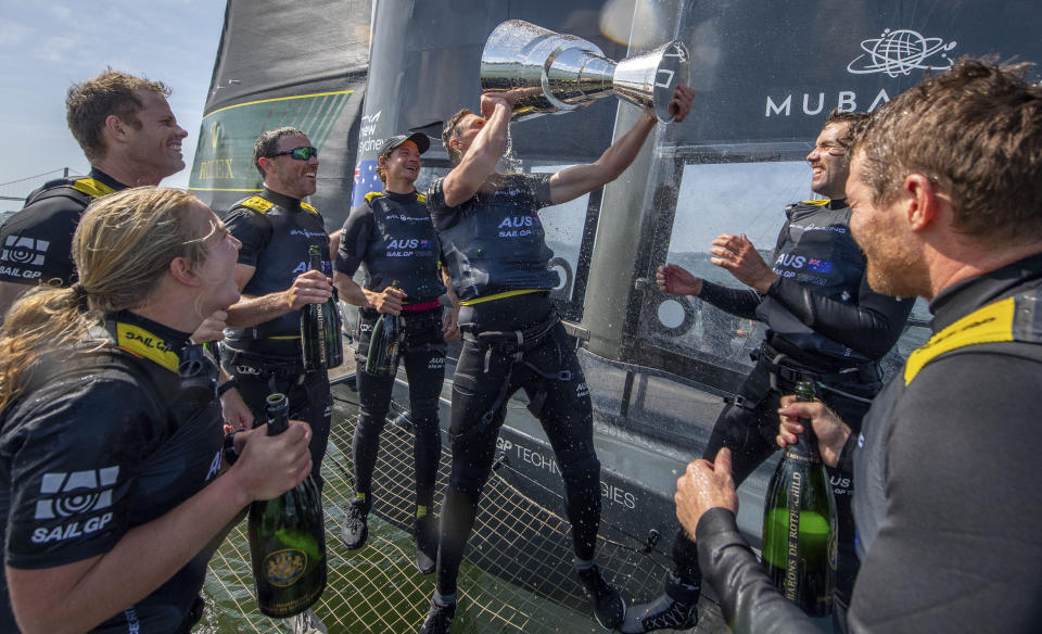 In this photo provided by SailGP, Australia SailGP Team celebrate winning the Mubadala SailGP Season 3 Grand Final with Barons de Rothschild champagne on Race Day 2 of the Mubadala SailGP Season 3 Grand Final in San Francisco, Sunday, May, 7 2023. (Bob Martin/SailGP via AP)