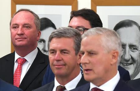 Former Australian deputy prime minister Barnaby Joyce listens to Michael McCormack speak after he was elected as the new leader of the country's National Party and thus becoming Australia's new deputy prime minister in Canberra, Australia, February 26, 2018. AAP/Lukas Coch/via REUTERS