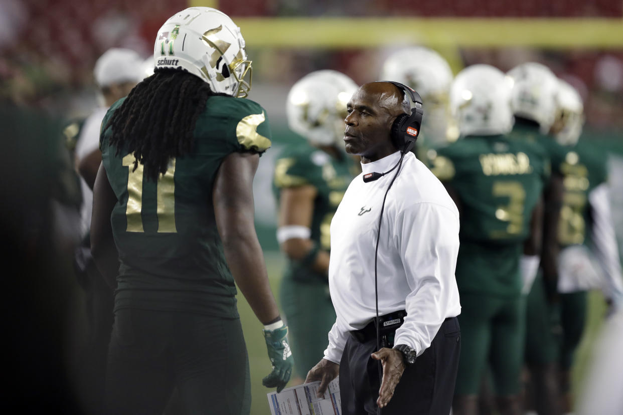 South Florida head coach Charlie Strong talks to linebacker Dwayne Boyles Jr., during the second half of an NCAA college football game against Memphis Saturday, Nov. 23, 2019, in Tampa, Fla. (AP Photo/Chris O'Meara)