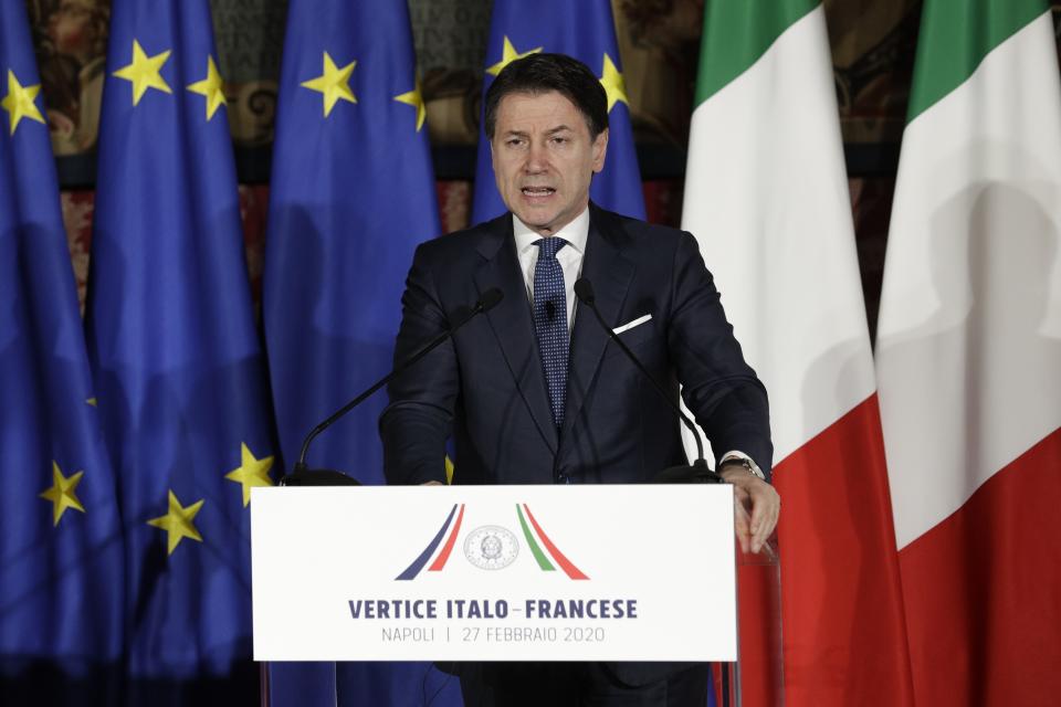 Italian Premier Giuseppe Conte speaks during a joint press conference with French President Emanuel Macron, on the occasion of the first  French-Italian summit in more than two years, in Naples, southern Italy, Thursday, Feb. 27, 2020. (AP Photo/Andrew Medichini)