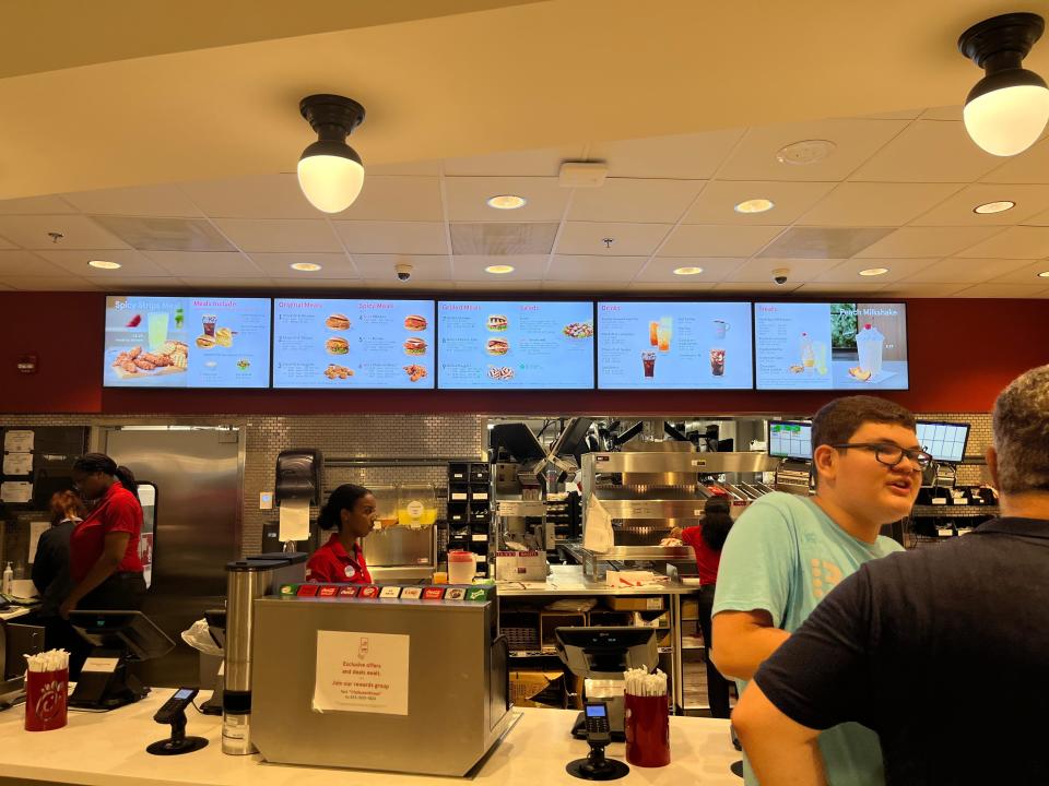 the register and menu area at a chick fil a in toronto