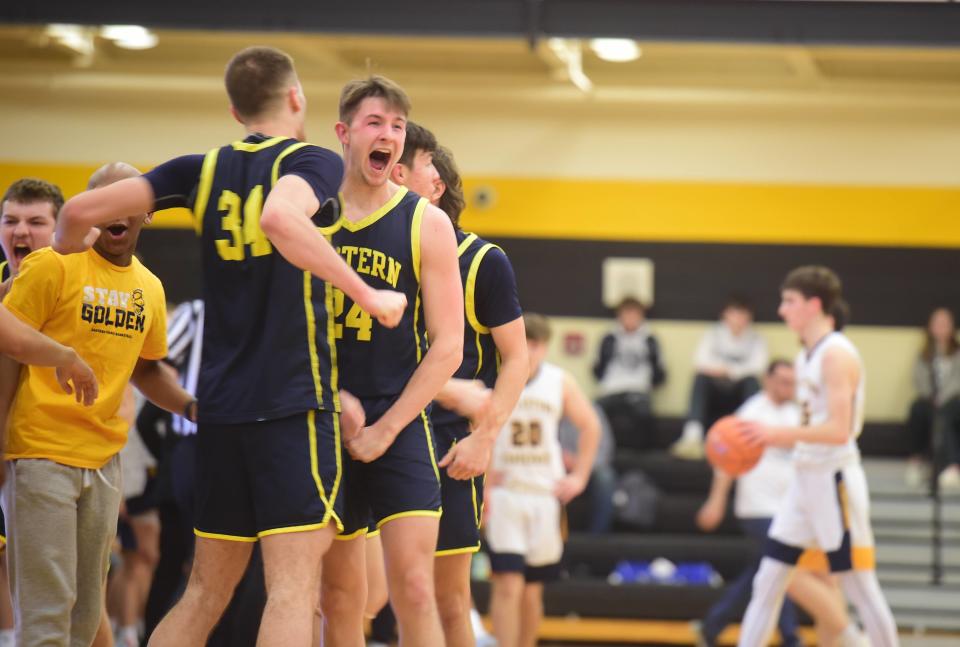 Eastern York's Austin Bausman (No. 24) celebrates with Carter Wamsley after beating Littlestown Friday. Bausman led Eastern York with 18 points. Eastern York beat Littlestown, 57-49, in the YAIAA boys' basketball quarterfinals at Red Lion High School, Friday, Feb. 11, 2023.