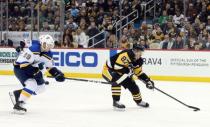 Mar 16, 2019; Pittsburgh, PA, USA; Pittsburgh Penguins center Sidney Crosby (87) skates up ice with the puck as St. Louis Blues defenseman Vince Dunn (29) chases during the second period at PPG PAINTS Arena. Mandatory Credit: Charles LeClaire-USA TODAY Sports