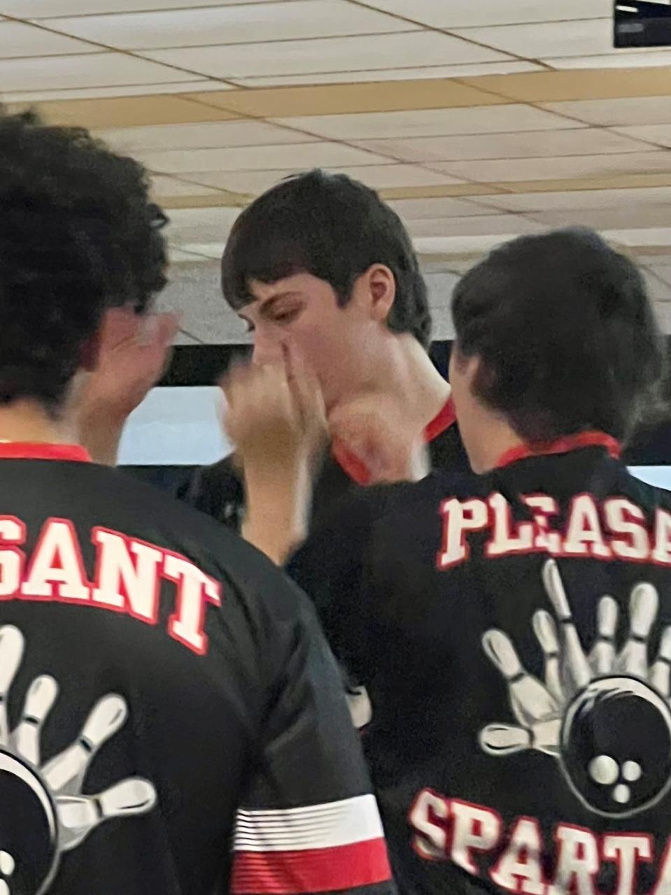 Pleasant's boys bowling team congratulates Johnathan Maran after a strike during the Mid Ohio Athletic Conference Bowling Tournament Saturday at Victory Lanes in Galion.