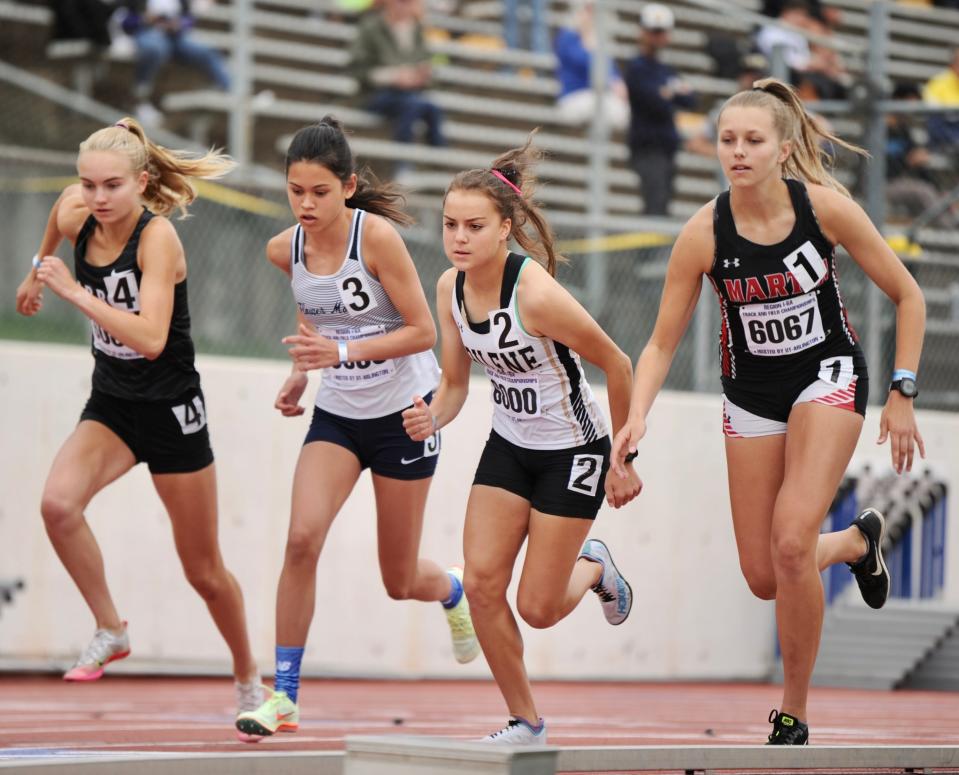 Abilene High's Mason Murray runs in the 3,200 at the Region I-6A track and field meet in Arlington.