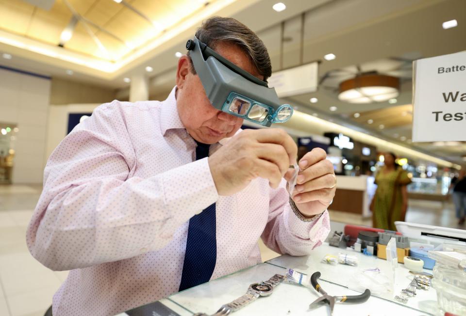 Marcelo Sandivar, certified watch technician and owner of Fashion Watch & Clock, works on a watch at the company’s kiosk in Fashion Place Mall in Murray on Thursday, Aug. 24, 2023. | Kristin Murphy, Deseret News