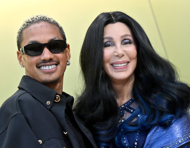 WEST HOLLYWOOD, CALIFORNIA – MARCH 09: Alexander Edwards and Cher attend the Versace FW23 Show at Pacific Design Center on March 09, 2023 in West Hollywood, California. (Photo by Axelle/Bauer-Griffin/FilmMagic)