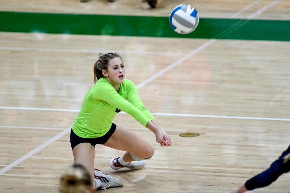 Lakewood's Carley Piercefield hits the ball in the game against Onsted during the first set on Tuesday, Nov. 16, 2021, at Williamston High School.