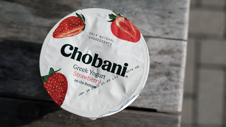 yogurt cup with expiration date visible