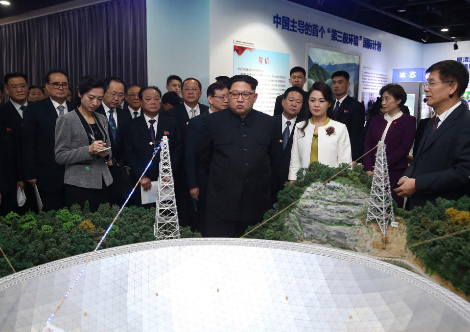 <p>In this photo released Wednesday, March 28, 2018 by China’s Xinhua News Agency, North Korean leader Kim Jong Un, center, and his wife Ri Sol Ju, visit an exhibition highlighting achievements by the Chinese Academy of Sciences. (Photo: Yao Dawei/Xinhua via AP) </p>