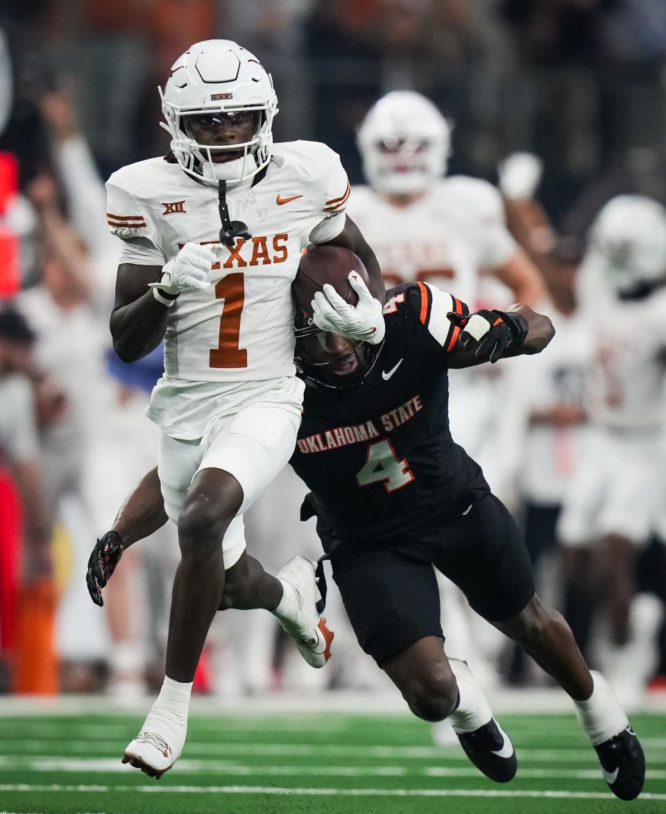 Texas wide receiver Xavier Worthy returns a kickoff in the first quarter of the Big 12 championship game win over Oklahoma State. It's Worthy's contributions as a punt returner, where his average per return is No. 2 nationally, that has helped make him one of Texas' most explosive players.