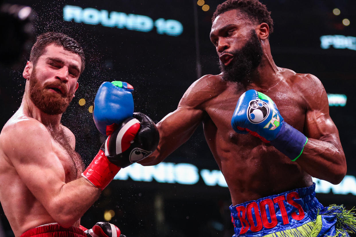 WASHINGTON, DC - JANUARY 07: Jaron Ennis punches Karen Chukhadzhian in their Interim IBF Welterweight Championship bout at Capital One Arena on January 7, 2023 in Washington, DC. (Photo by Patrick Smith/Getty Images)