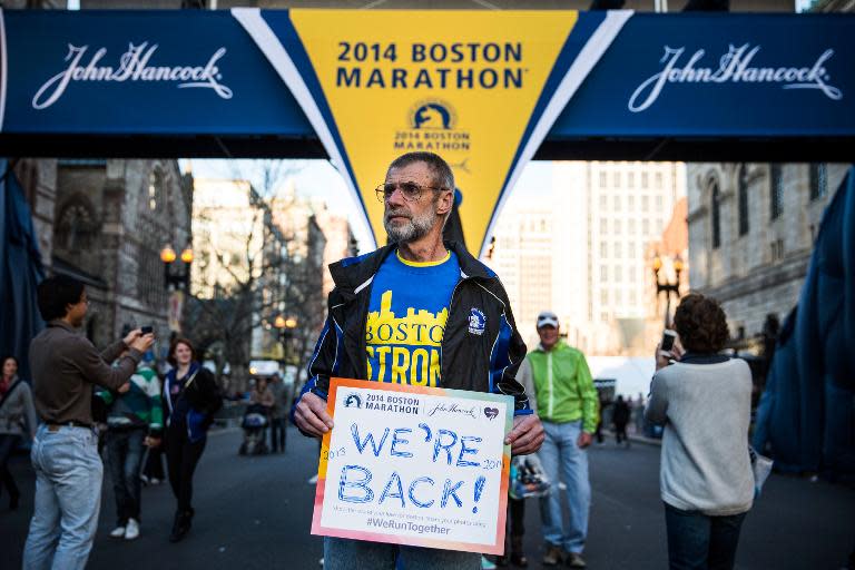 Bill Sved, who ran the Boston Marathon last year and is running again this year, poses at the finish line of the Boston Marathon on April 19, 2014