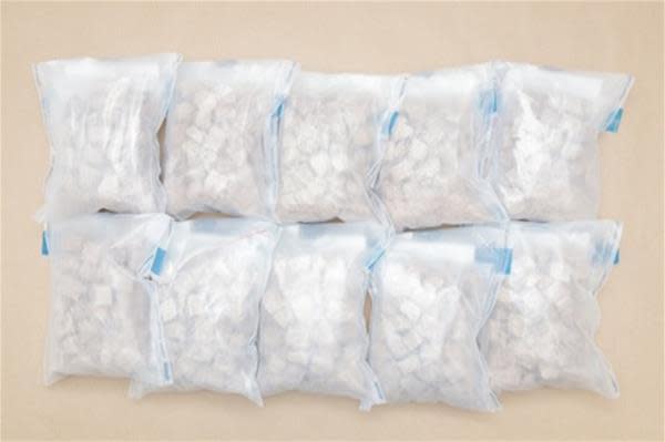 Bundles of heroin seized from a Malaysia-registered car at Woodlands Checkpoint on 5 August 2023. (Photo: CNB)