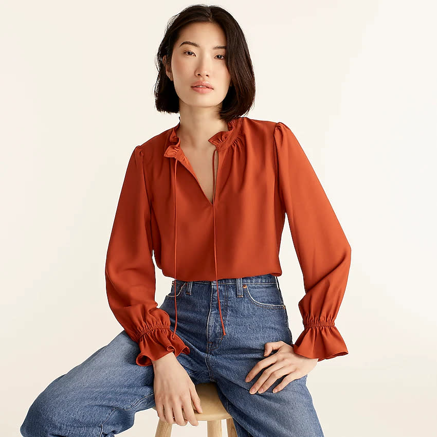 Woman in orange blouse. (Photo: J.Crew)