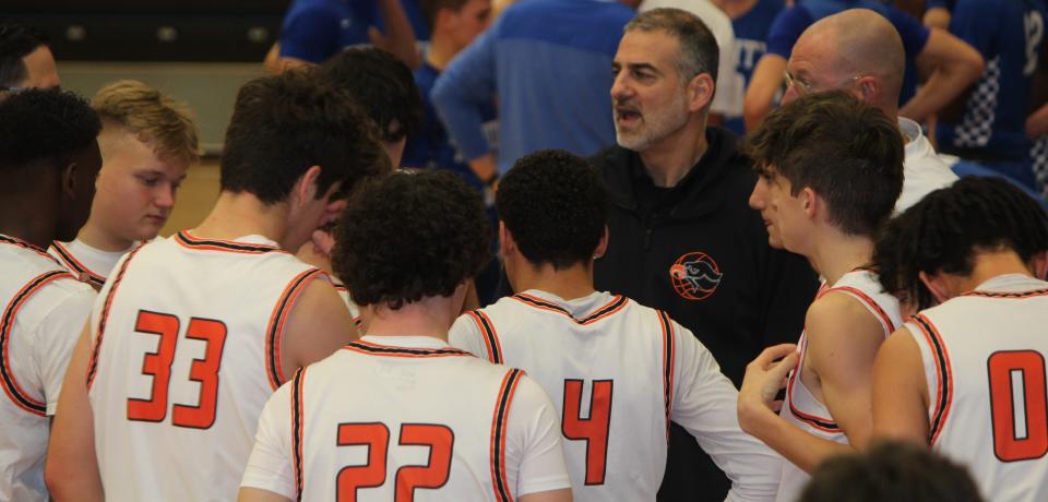 Bethel Park head coach Dante Calabria (center) directs his players during a stoppage in a game in early January.