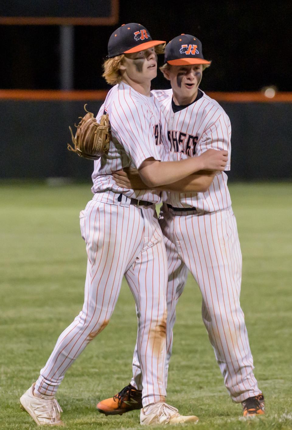 Washington's Easton Harris, left, and Jake Stewart celebrate their 3-2 victory over Galesburg in the Class 3A baseball sectional semifinal Wednesday, June 1, 2022 at Brian Wisher Field in Washington. The Panthers will face Morton for the sectional title at 11 a.m. Saturday in Washington.